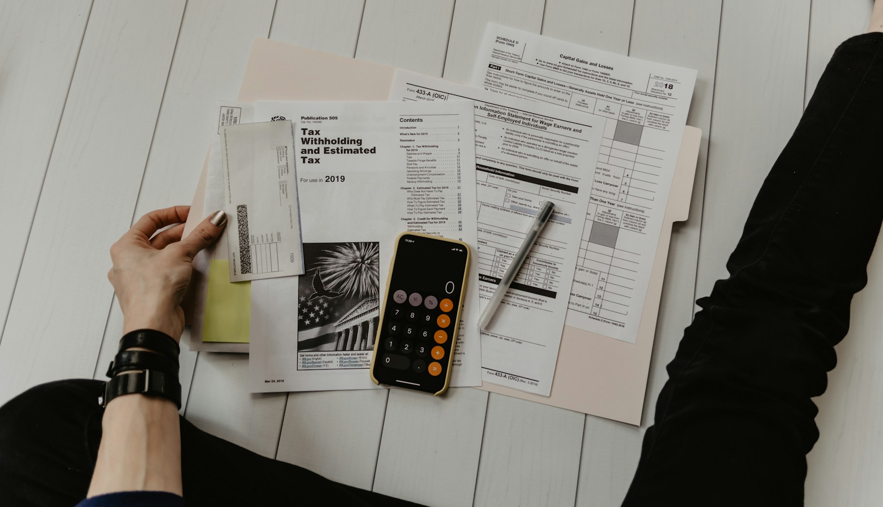 Financial documents and notes used for fraud evidence review
