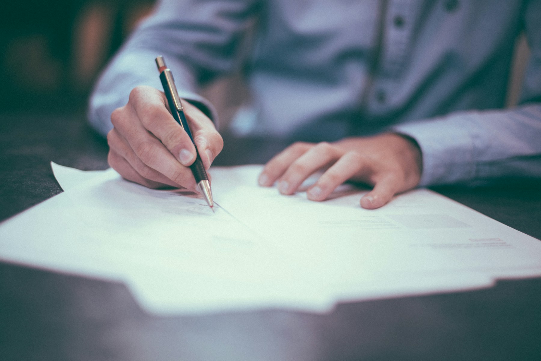 Confidential investigation case files on a professional desk
