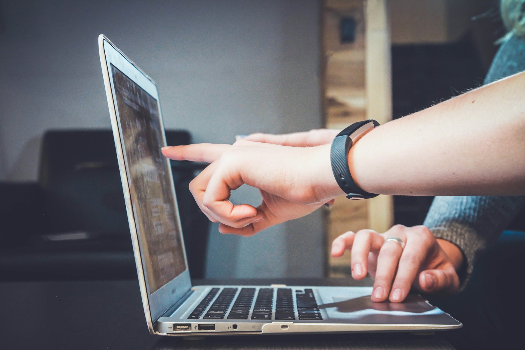 Investigator reviewing digital evidence on a laptop